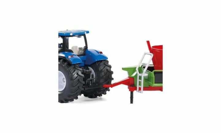 New Holland mit Frontlader und Strautmann Futtermischwagen – Bild 2